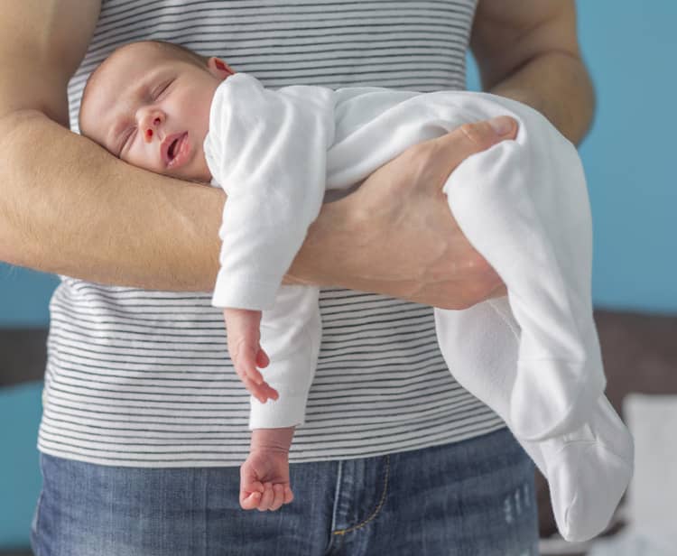 Carrying the baby on the arms position