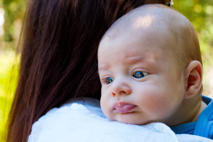 Vertical burping position over the shoulder