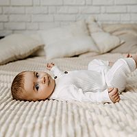 4-month-old baby in a bed