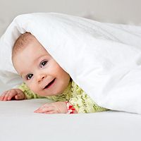 6-month-old baby in a bed