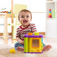 7-month-old baby with a toy